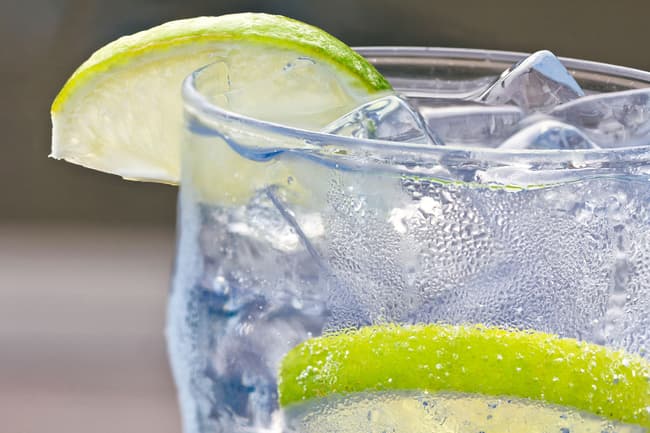photo of glass of sparkling water and lime