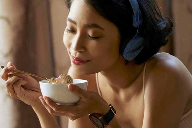 woman eating bowl of ice cream
